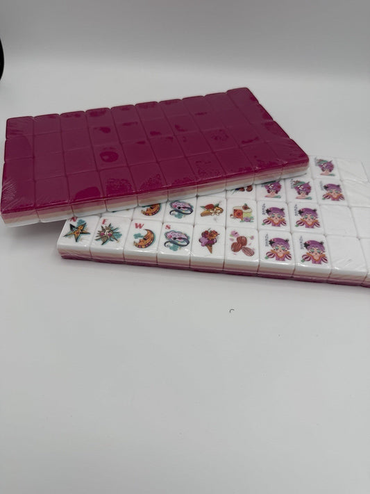 Luxury Mahjong glitter pink American Mahjong tiles with whimsical artwork and white faces in a 160-piece set.
