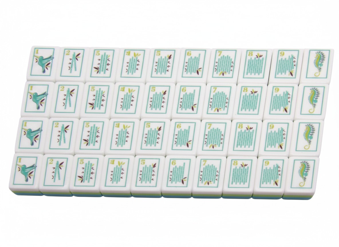 The Sea Glass Pearl American Mahjong tiles with a hand-illustrated seashell motif in teal, sage and antique gold