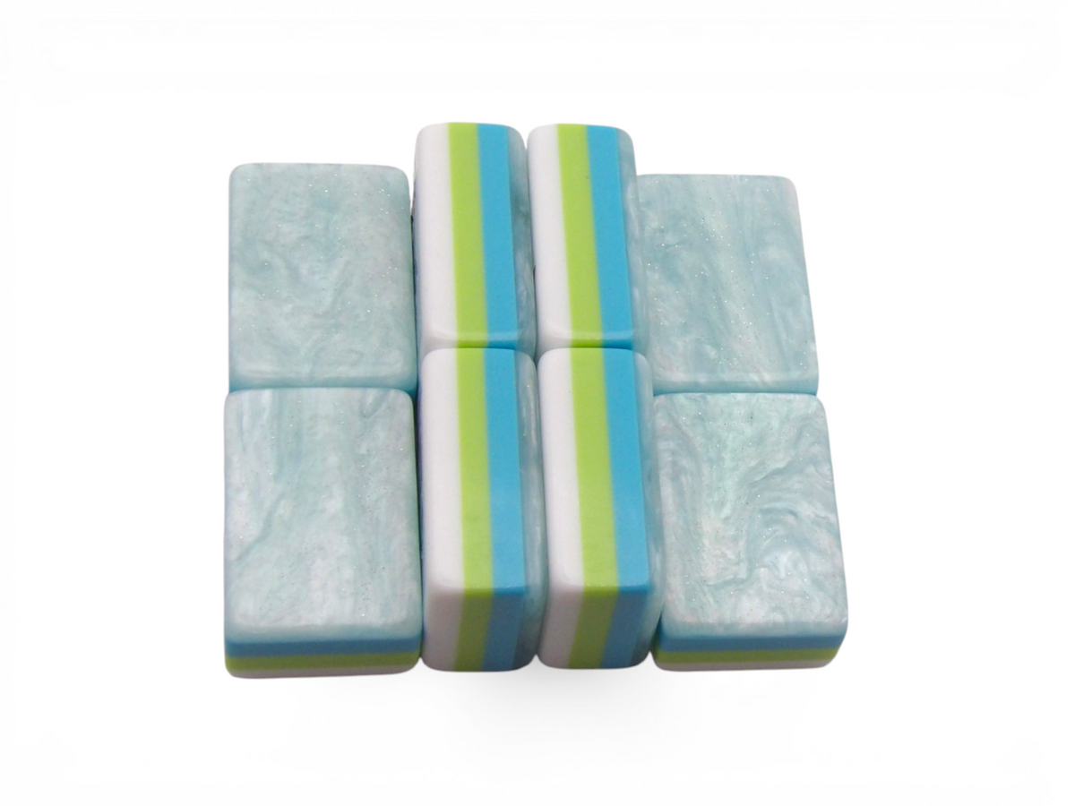 The Sea Glass Pearl American Mahjong tiles with a hand-illustrated seahorse motif in teal, sage and antique gold