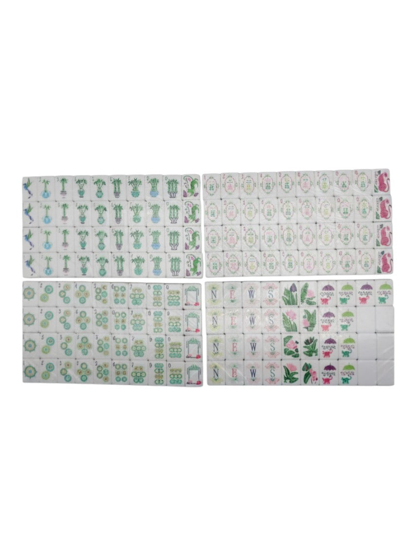 The Bamboo Grove mahjong tiles fanned out showing tropical botanical artwork