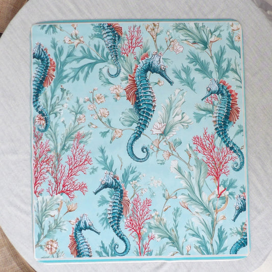 Aqua mahjong mat with an all-over pattern of teal seahorses, red branching coral and pale sea fronds