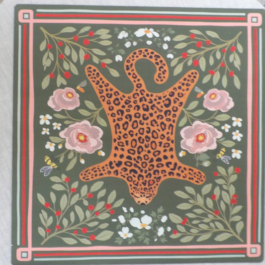Olive green mahjong mat with a folk-art leopard pelt motif surrounded by pink roses, white daisies, red berries and bees