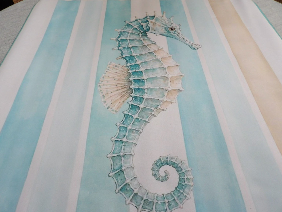 Close-up of the Seahorse Cabana mahjong mat showing the watercolor seahorse and the sand-colored stripe