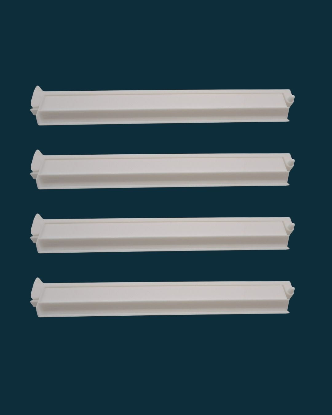 White acrylic mahjong rack shown holding a full hand of tiles