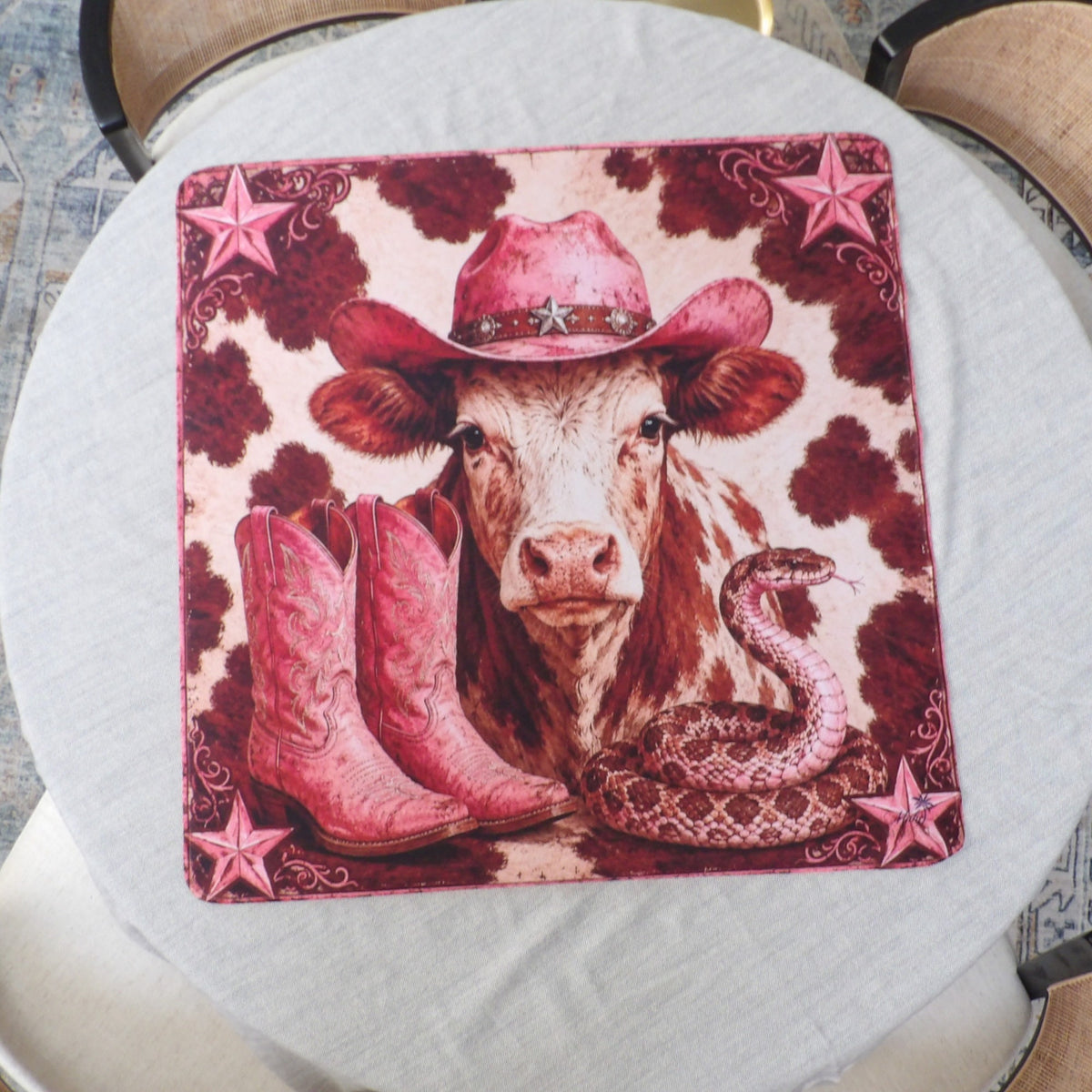 Pink cowgirl mahjong mat laid flat — Hereford cow in a rhinestone pink cowboy hat with pink boots and a rattlesnake on burgundy cowhide