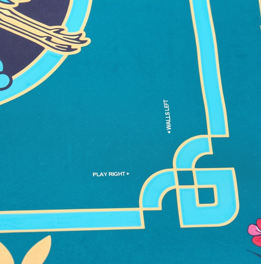 Corner detail showing the printed NMJL play guide — Walls Left and Play Right worked into the bamboo border