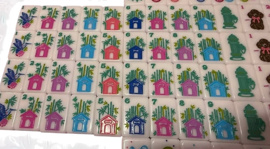Best in Show mahjong tiles with dog breeds beside Chinese characters