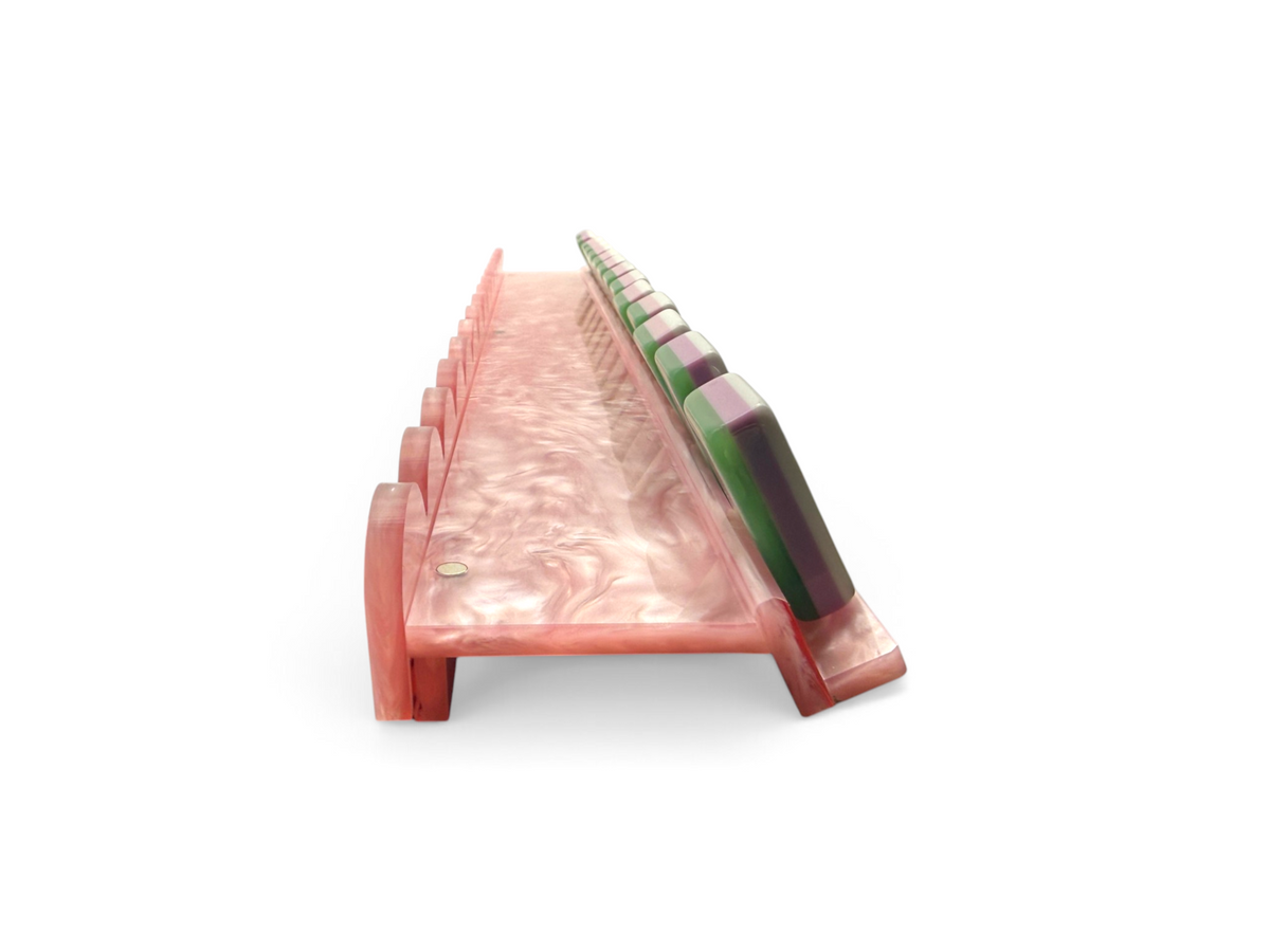 Pink pearl mahjong racks stacked for storage using top magnets