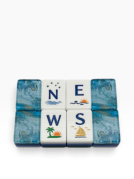 Luxury Mahjong Anchor & Tide wind tiles featuring coastal postcard illustrations on white acrylic with navy backs