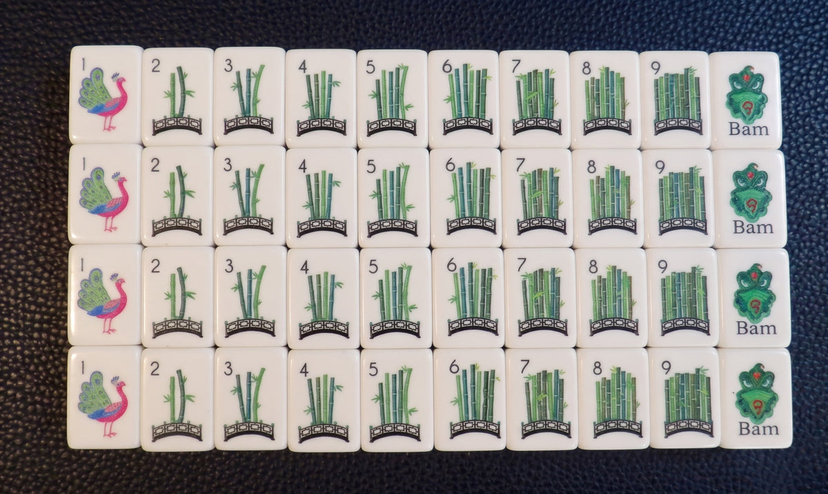 Luxury Mahjong Blue Willow American mahjong set featuring peacock and bamboo garden bridge tiles on white acrylic