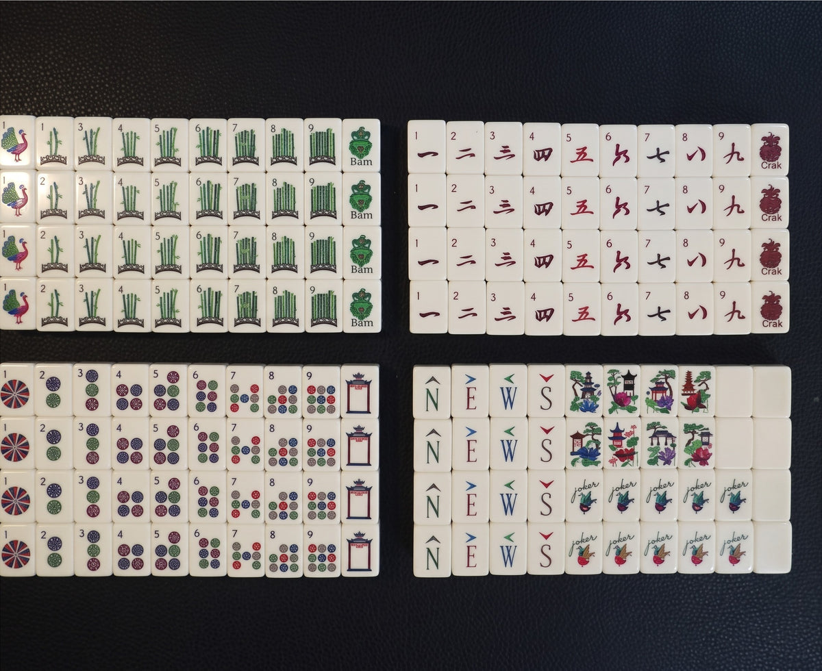 Luxury Mahjong Blue Willow American mahjong set featuring etched acrylic tiles with garden, pagoda, and floral motifs.