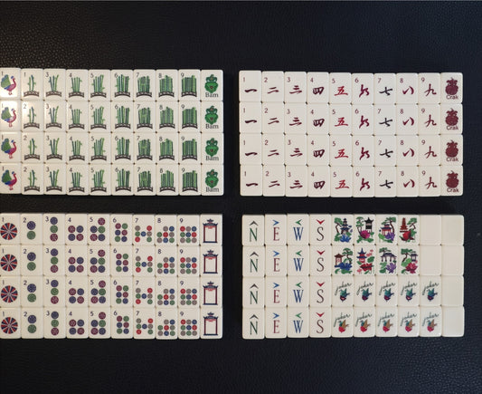 Luxury Mahjong Blue Willow American mahjong set featuring etched acrylic tiles with garden, pagoda, and floral motifs.