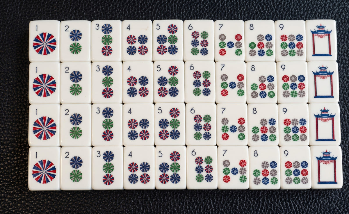 Luxury Mahjong Blue Willow American mahjong set featuring detailed multicoloured dot and pagoda acrylic tiles.