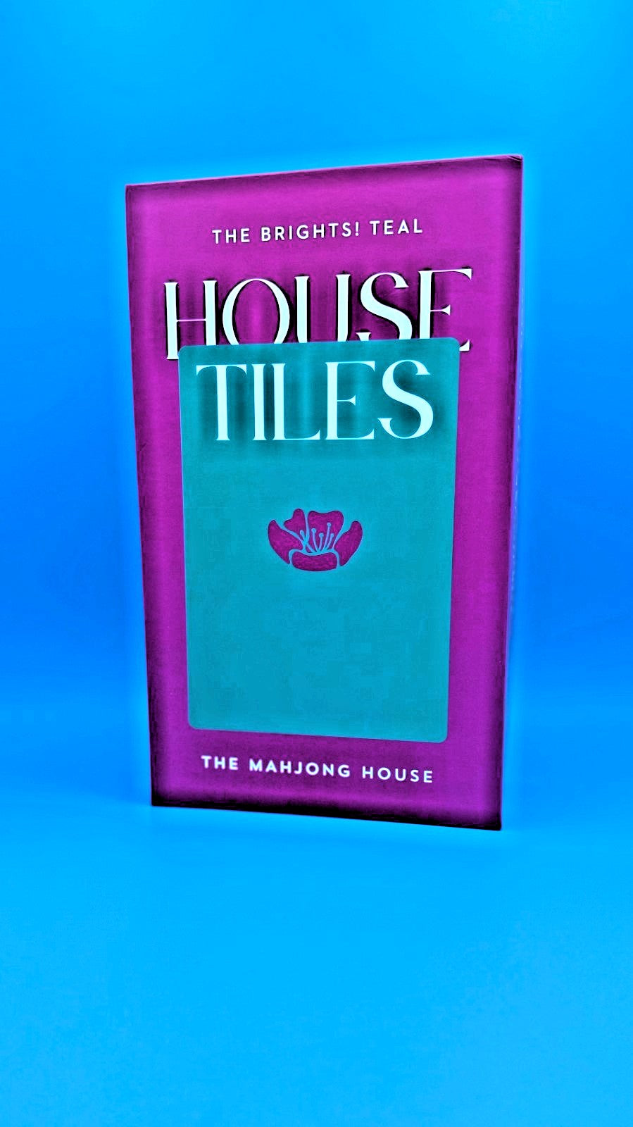 Luxury Mahjong The Brights! Teal House Tiles set in a vibrant purple and teal box with a floral logo design.