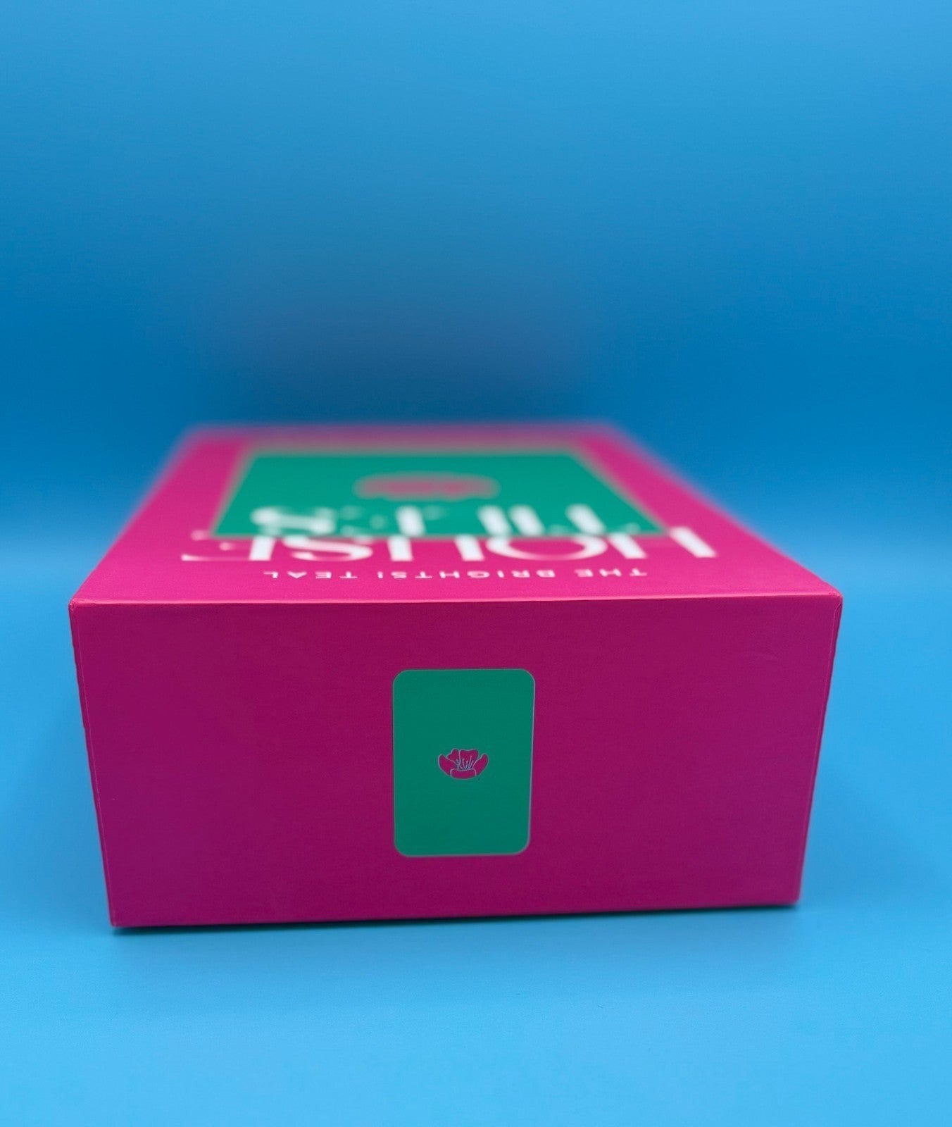 Luxury Mahjong The Brights! Teal House Tiles set in a vibrant pink box with teal accents and floral branding.