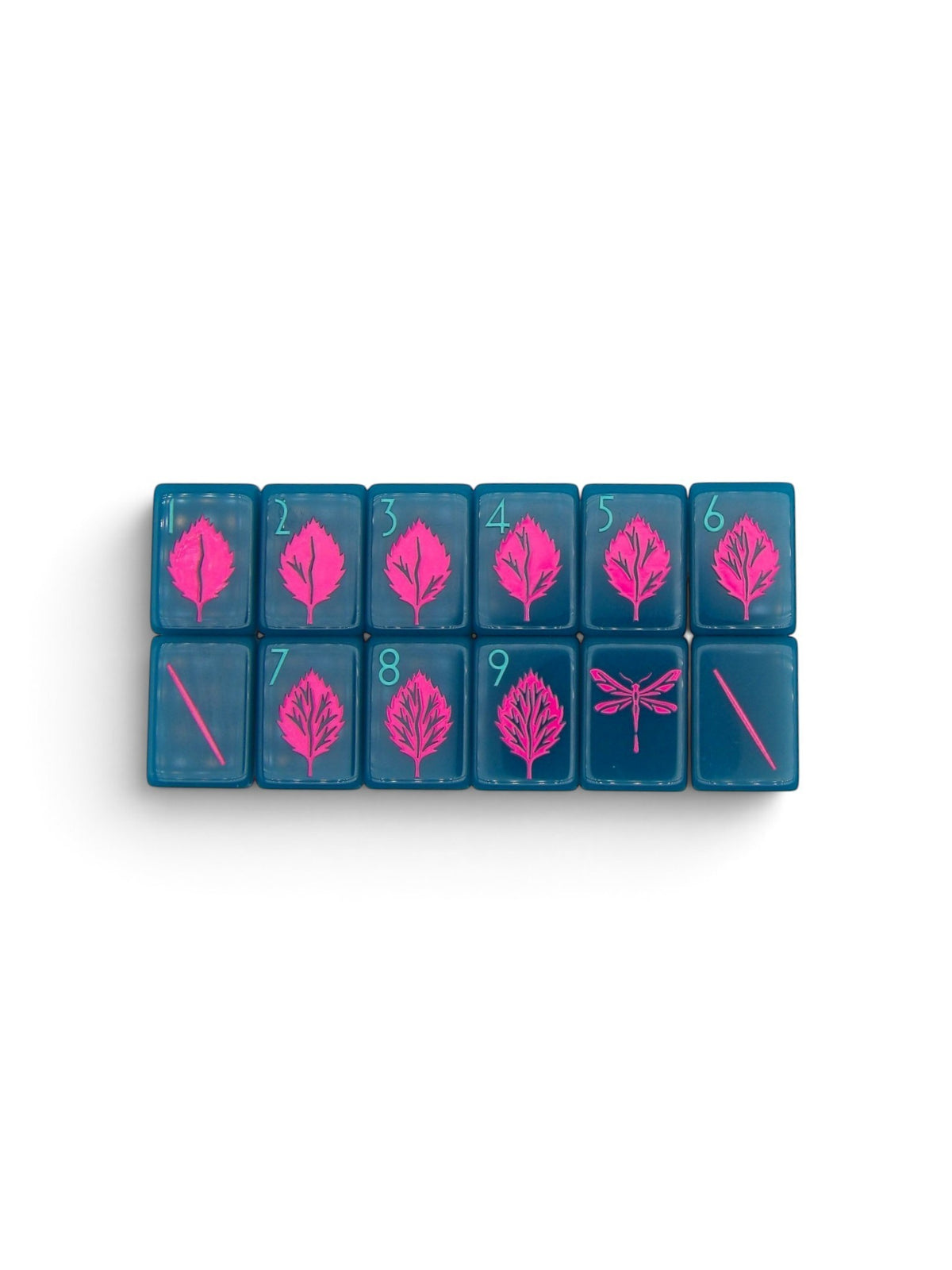 Luxury Mahjong Electric Bloom acrylic tiles in deep teal with hot pink botanical leaf and dragonfly designs.