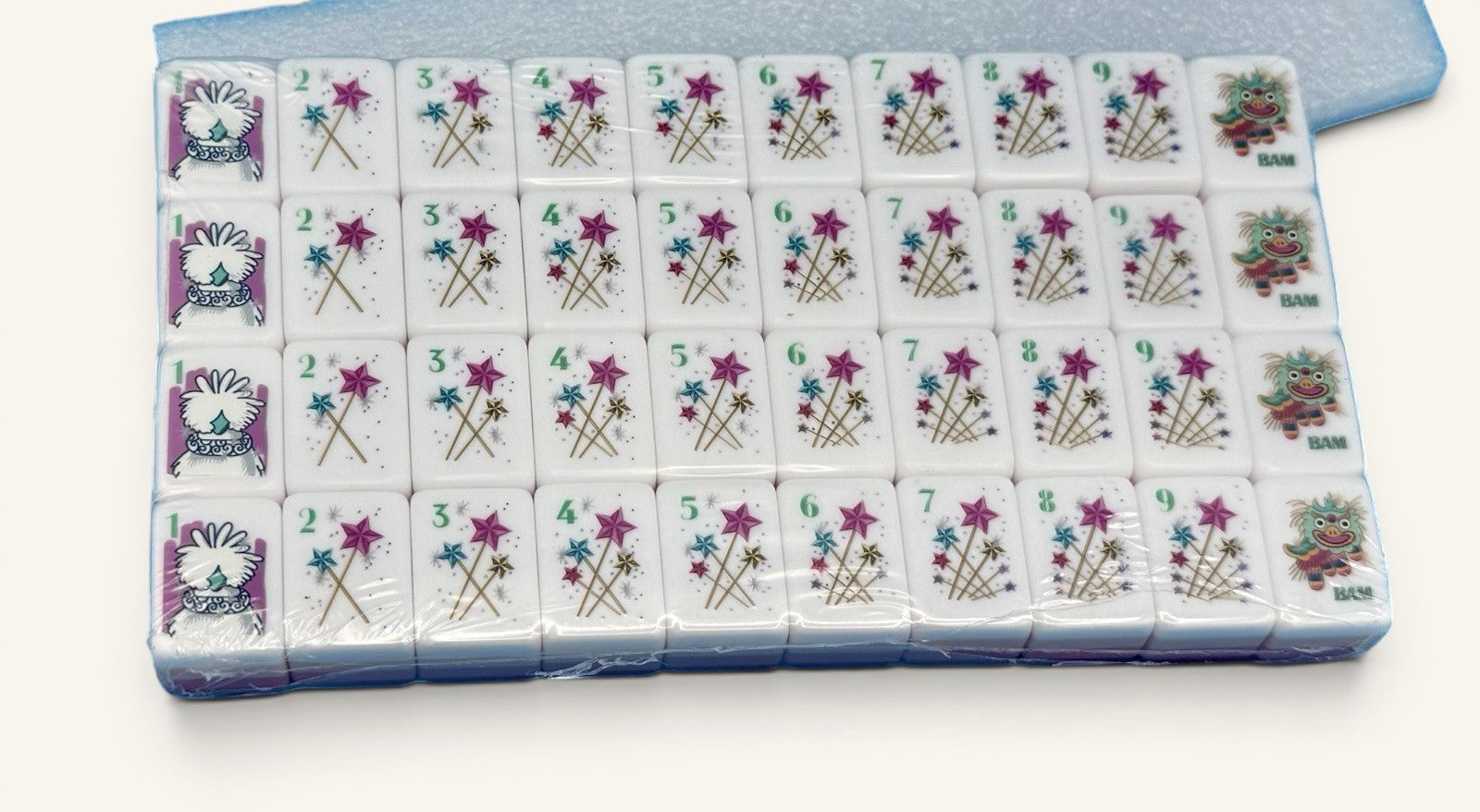 Luxury Mahjong glitter pink American Mahjong tiles featuring whimsical star designs and colorful dragon artwork