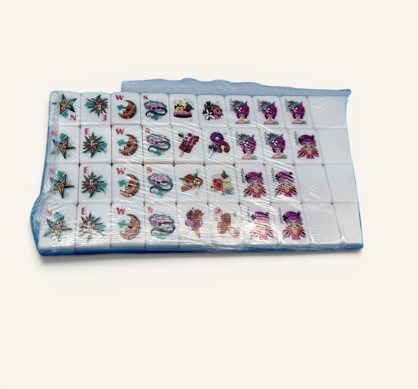 Luxury Mahjong glitter pink American Mahjong tiles with whimsical colorful designs and white acrylic faces in plastic wrap