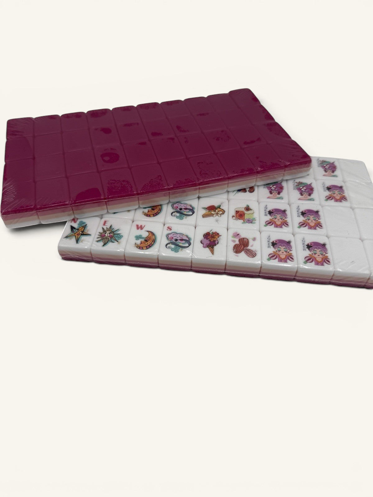 Luxury Mahjong glitter pink American Mahjong tiles with whimsical colorful designs and white faces in a gift set