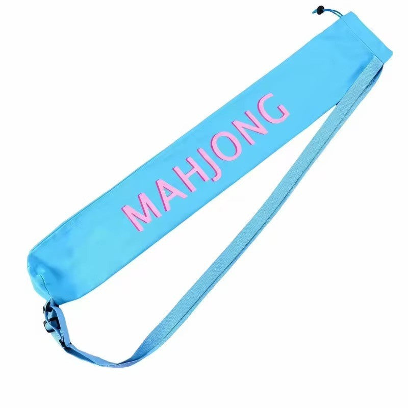 Luxury Mahjong light blue canvas mat bag with pink lettering, drawstring closure, and adjustable shoulder strap.