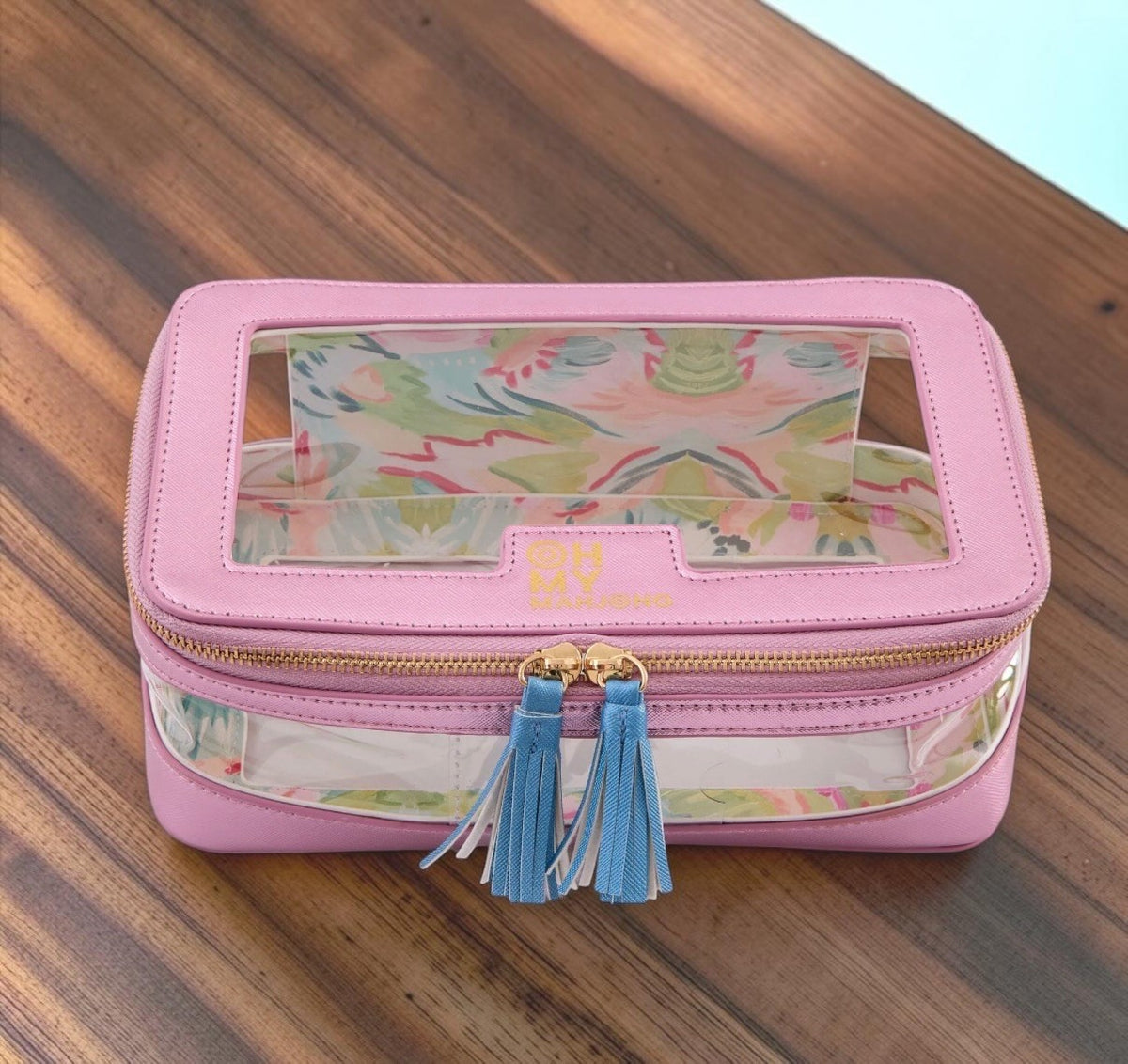 Luxury Mahjong metallic light pink tile case with clear lid, floral interior, gold hardware, and blue tassel pulls.