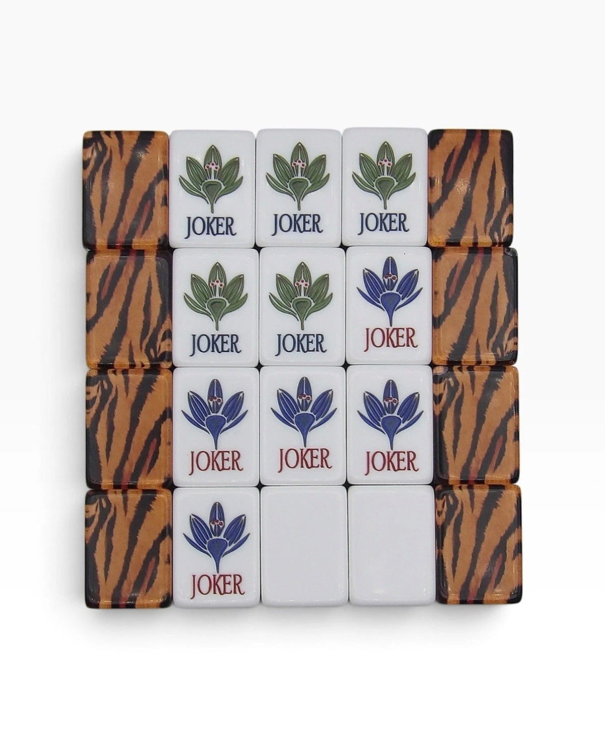 Luxury Mahjong Tiger Lily set featuring ivory Joker tiles with lotus blooms and amber tiger-striped backs.