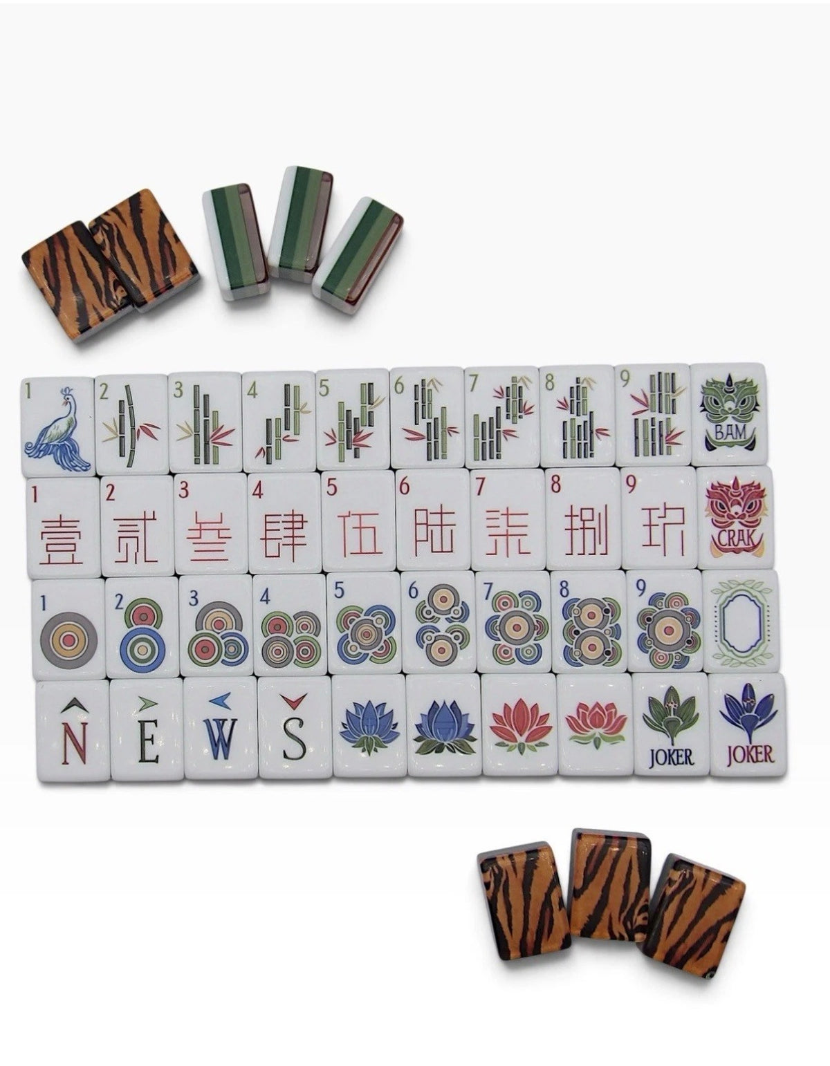 Luxury Mahjong Tiger Lily set featuring ivory tiles with colorful bamboo, character, dot, and floral designs.