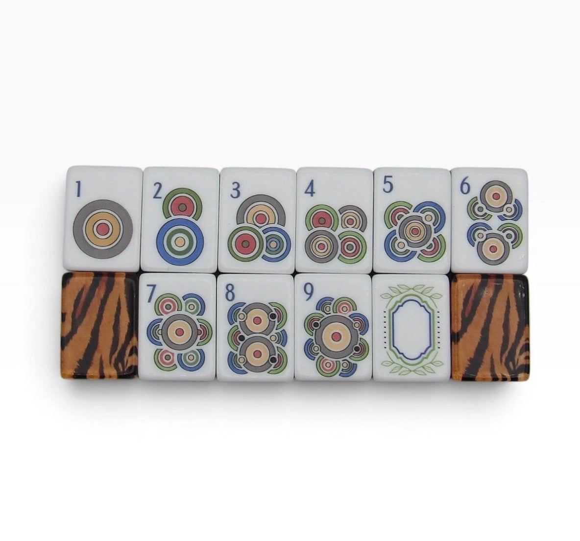 Luxury Mahjong Tiger Lily set featuring ivory tiles with colorful dot patterns and amber tiger-stripe backs.