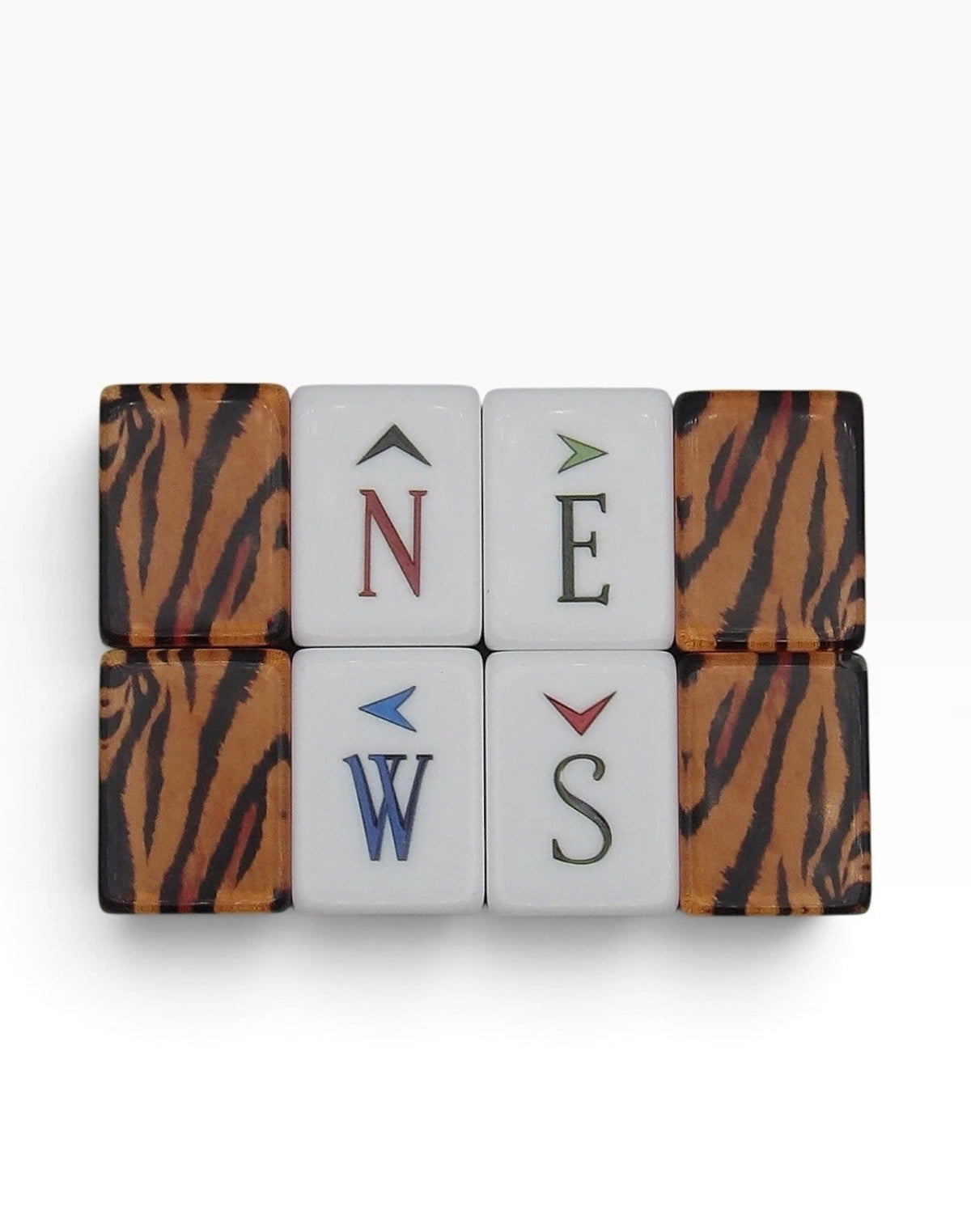 Luxury Mahjong Tiger Lily set showing ivory wind tiles with colored directional letters and amber tiger stripe backs.