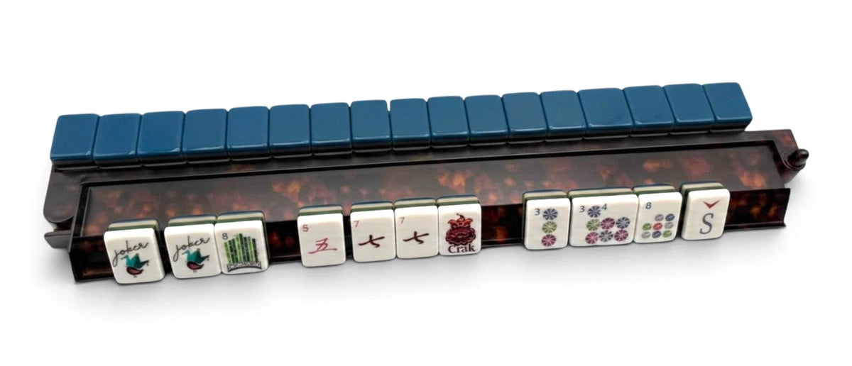 Luxury Mahjong tortoiseshell acrylic rack with hinged pusher holding blue and white mahjong tiles