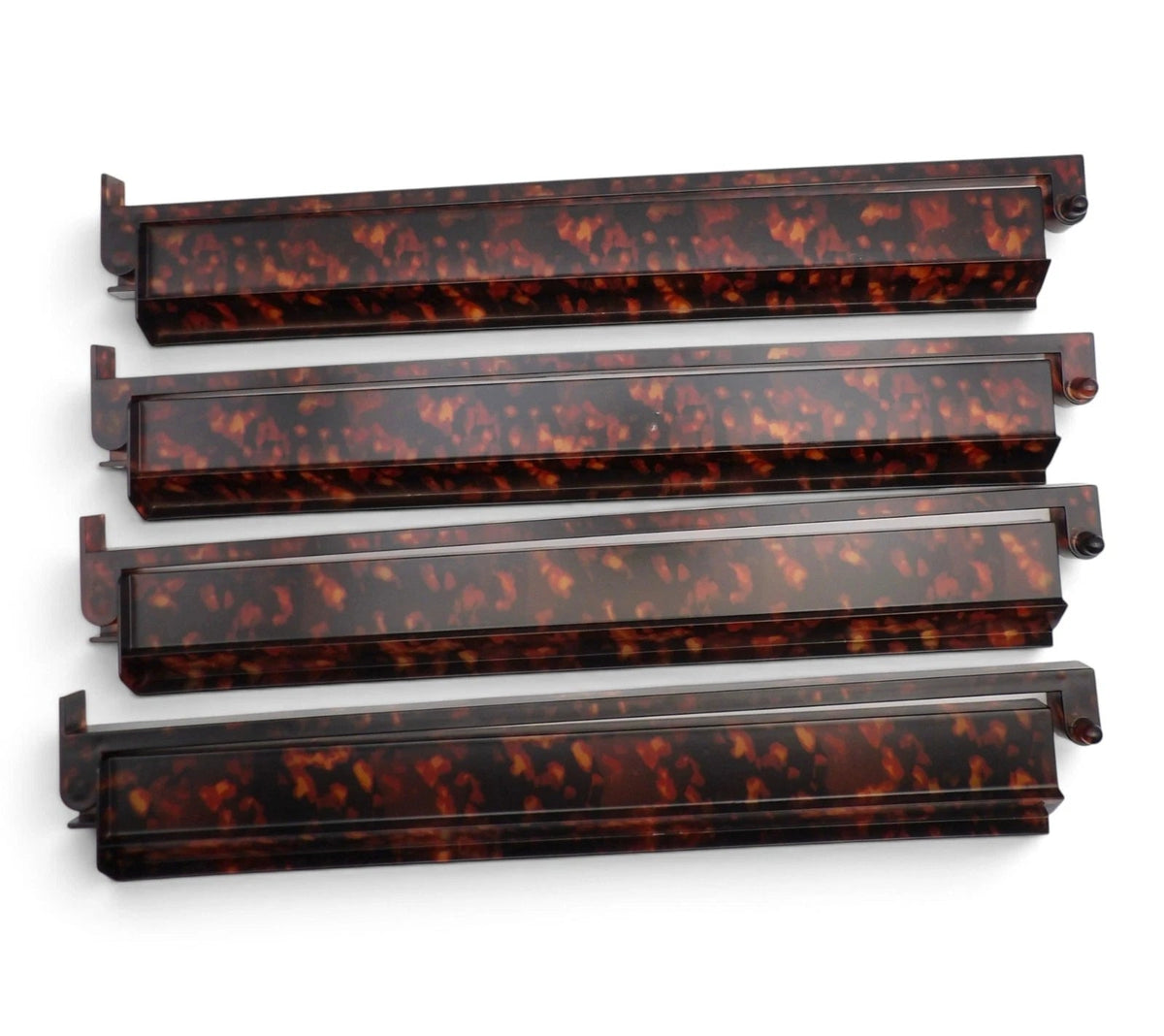 Luxury Mahjong set of four 18.5-inch tortoiseshell acrylic racks with attached hinged pushers in amber and brown.