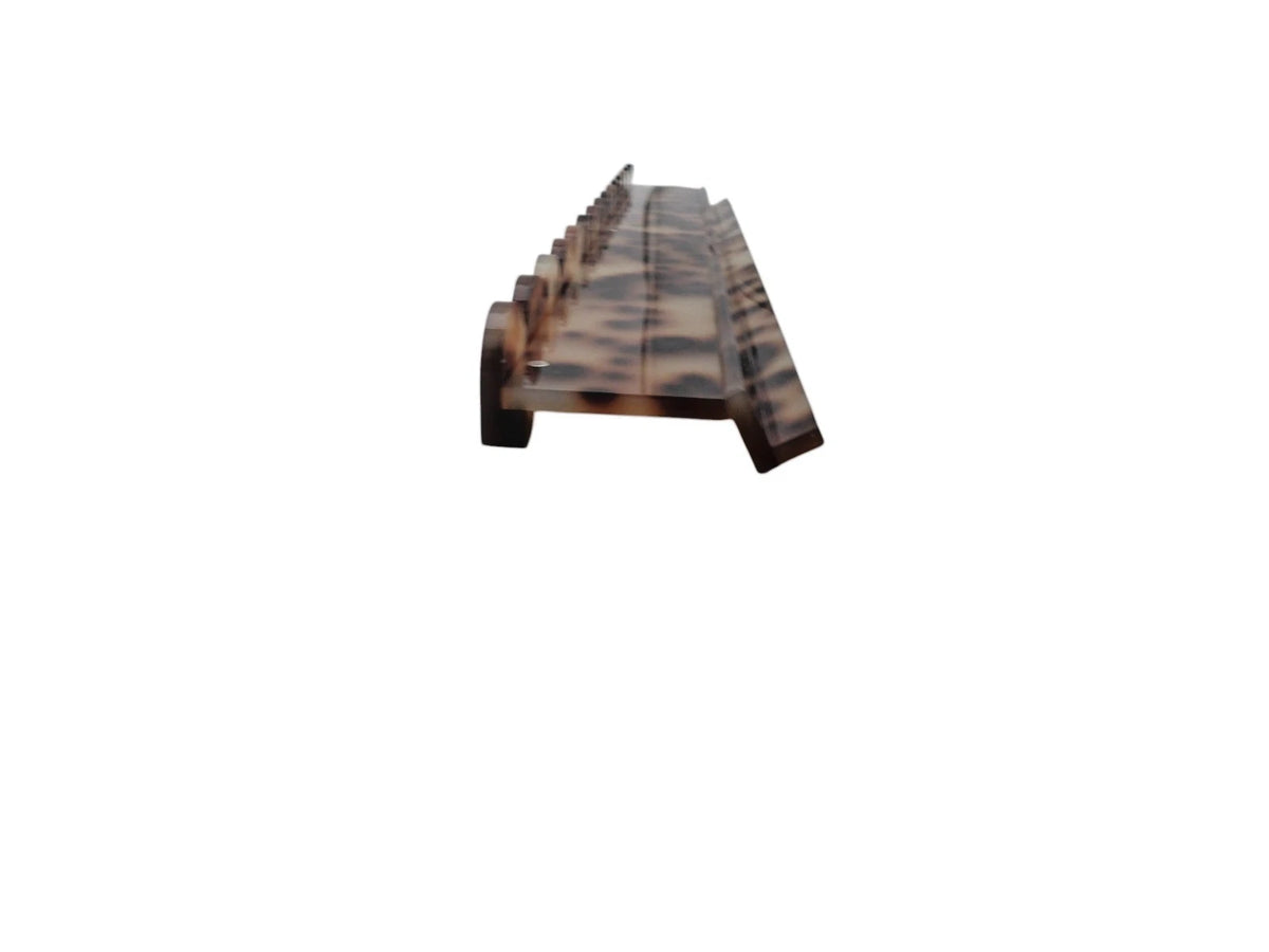 Blond tortoiseshell mahjong racks stacked for storage using top magnets