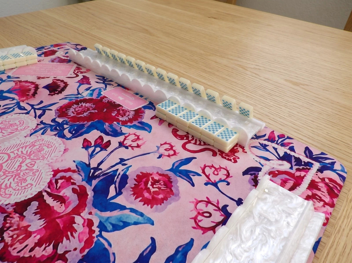 White Wave scalloped mahjong rack holding a hand of tiles
