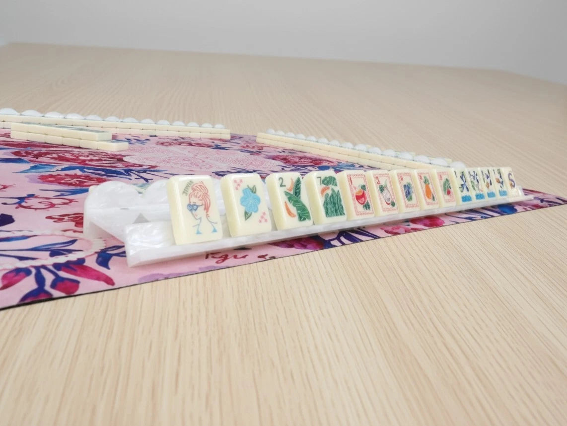 White mahjong racks stacked for storage using top magnets