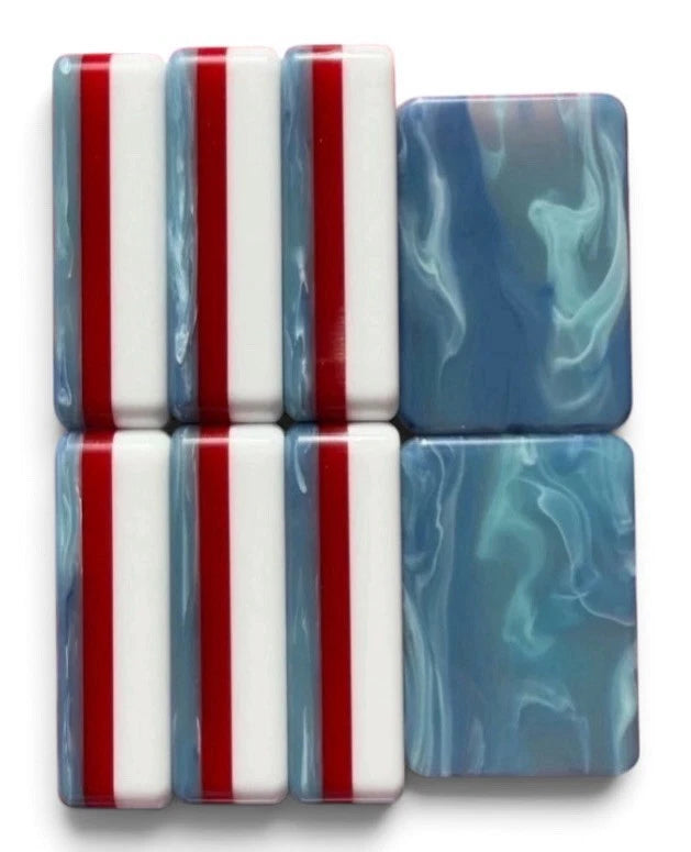 Red White & Bam patriotic fireworks mahjong tile artwork — red and navy palette close-up, detail 1
