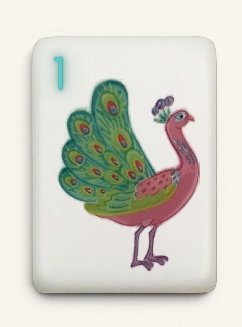 Close-up of Luxury Mahjong Tortoise & Plume 1 Bam tile with original hand-illustrated peacock artwork